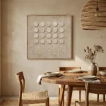 Minimalist hand-painted canvas featuring twenty cream circles and linear texture detail in neutral tones, contemporary dining space