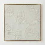 Textured abstract hand-painted canvas with interlocking concentric circles in cream and white, contemporary living space