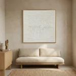 Textured minimalist hand-painted canvas with layered white gestural marks and vertical drip details, cream and ivory palette, contemporary living space