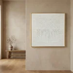 Textured minimalist hand-painted canvas with gestural drip marks in cream and ivory tones, contemporary interior