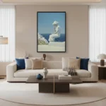 Figurative hand-painted canvas depicting contemplative seated figure in cream and blue tones, Mediterranean coastal setting, contemporary living space