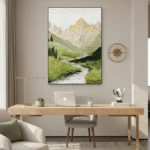 Contemporary landscape hand-painted canvas depicting misty mountains, flowing stream, and green valley in muted earth tones, modern workspace