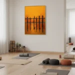 Minimalist hand-painted canvas with black vertical lines against warm orange and golden gradient, yoga studio setting