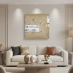 Textured abstract hand-painted canvas in warm gold and cream with white gestural marks, contemporary living space