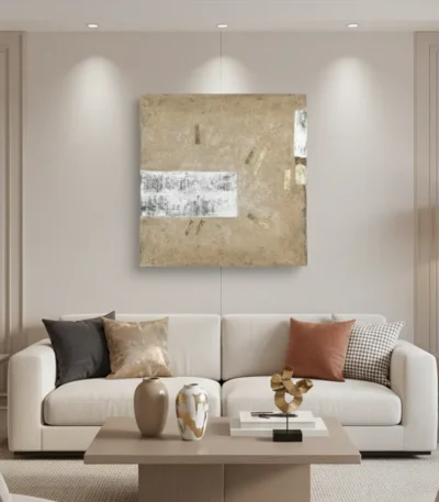 Textured abstract hand-painted canvas in warm gold and cream with white gestural marks, contemporary living space