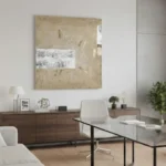 Textured abstract hand-painted canvas in cream and taupe tones with gestural marks, contemporary office space