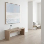 Minimalist landscape hand-painted canvas in soft blue and cream tones, contemporary entryway