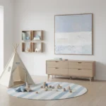 Minimalist landscape hand-painted canvas in soft blue and cream tones depicting layered horizons, styled in contemporary nursery