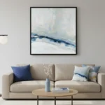 Layered abstract landscape hand-painted canvas in soft blues, whites, and grays depicting misty mountains, contemporary living space
