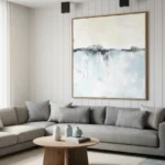 Layered abstract landscape hand-painted canvas in soft blues and grays with dark horizon line, contemporary living space