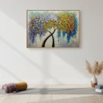 Textured abstract hand-painted canvas featuring an expressive tree with cascading silver, gold, and blue foliage, contemporary living space