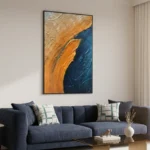Gestural abstract hand-painted canvas with sweeping orange and deep navy brushstrokes, textured impasto finish, contemporary living space