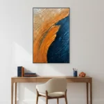 Gestural abstract hand-painted canvas with sweeping orange and deep navy brushstrokes, contemporary workspace