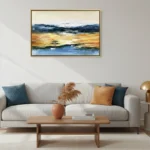 Impressionist landscape hand-painted canvas depicting golden sunset over tranquil water with solitary tree, blue and ochre tones, contemporary living space