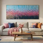Gestural abstract hand-painted canvas with cascading pink florals and arching stems, layered against cool blue and dark tones, contemporary living space