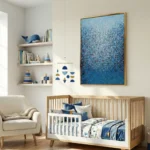 Textured abstract hand-painted canvas in layered blue tones with intricate gestural marks, nursery setting