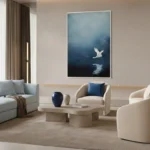Minimalist hand-painted canvas depicting a white bird in flight over moonlit water in deep blue and black tones, contemporary living space