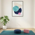 Minimalist abstract hand-painted canvas with layered geometric circles in turquoise, navy, blush pink and cream tones, contemporary yoga studio