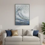Textured abstract expressionist painting depicting a cresting wave in layered blues and whites, hand-painted canvas in contemporary living space