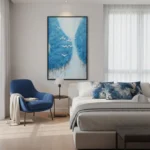 Contemporary landscape hand-painted canvas depicting birds flying through misty mountain valley in blue and white tones, modern bedroom