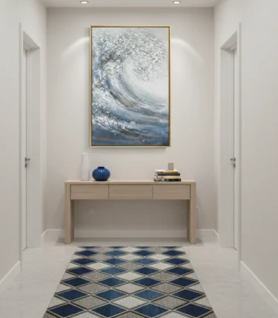 Textured abstract hand-painted canvas depicting dynamic ocean wave in layered blues, whites and grays, contemporary entryway