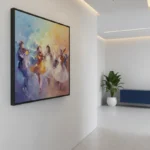 Gestural figurative hand-painted canvas depicting dancing figures in warm gold and purple tones, contemporary interior space