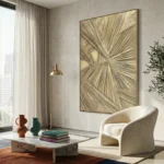Textured abstract hand-painted canvas with radiating linear patterns in cream and gold tones, contemporary living space