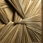 Textured abstract hand-painted canvas with layered natural fibers and woven elements in warm cream and gold tones