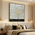 Abstract expressionist hand-painted canvas with bold black gestural strokes, gold leaf accents, cream and charcoal palette, modern bedroom
