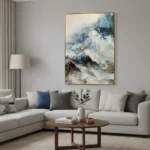 Abstract expressionist hand-painted canvas depicting layered snow-capped mountains in cool blues, whites, and charcoal tones, contemporary living space