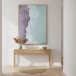 Minimalist abstract hand-painted canvas depicting layered coastal landscape in soft lavender, mint, and cream tones, contemporary entryway