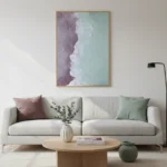 Minimalist abstract landscape hand-painted canvas depicting coastal waves and sandy shores in muted mauve, seafoam, and cream tones, contemporary living space