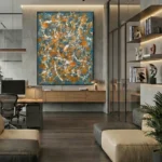 Gestural abstract expressionist hand-painted canvas in dynamic orange, blue, and cream brushstrokes, contemporary office space