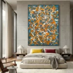 Gestural abstract expressionist hand-painted canvas in vibrant orange, blue and white dynamic brushstrokes, modern bedroom