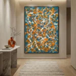 Gestural abstract expressionist hand-painted canvas in vibrant orange, teal blue and white drips, contemporary entryway