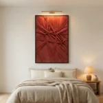 Textured abstract hand-painted canvas in deep crimson and burnt orange with dynamic linear brushstrokes, modern bedroom