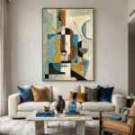Cubist hand-painted canvas depicting an abstracted guitar with geometric shapes in blue, ochre, and black tones, contemporary living space