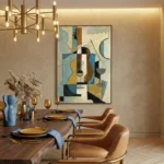 Cubist hand-painted canvas featuring abstracted guitar and geometric shapes in blue, ochre, and black tones, dining space setting