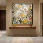 Gestural abstract hand-painted canvas with layered earth tones, cream, and vibrant color splashes, contemporary entryway