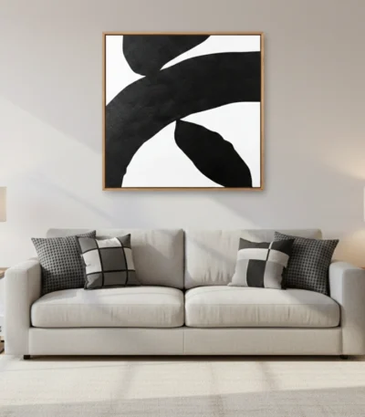 Minimalist abstract hand-painted canvas in bold black and white organic shapes, contemporary living space