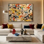 Gestural abstract expressionist hand-painted canvas with bold black lines and vibrant red, yellow, blue strokes, contemporary living space