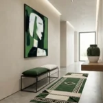 Contemporary abstract hand-painted canvas depicting stylized green and white figure portrait, modern hallway