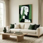 Gestural abstract painting featuring a stylized white profile head against layered green and black tones, hand-painted canvas in contemporary living space