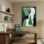 Contemporary abstract hand-painted canvas in green, white, and charcoal with gestural brushstrokes, modern office setting
