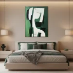 Contemporary abstract hand-painted canvas in layered green, white and black geometric forms, modern bedroom setting