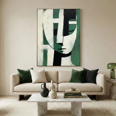 Contemporary abstract hand-painted canvas featuring geometric face with green, black and cream tones, modern living space