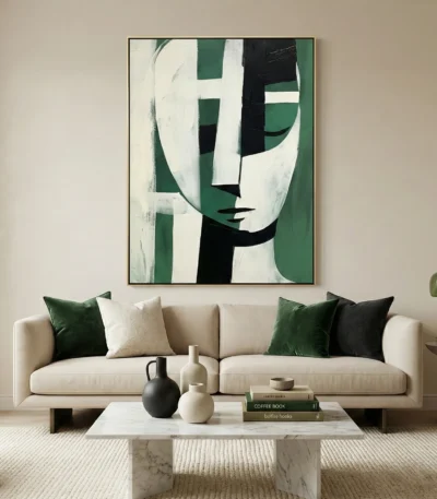 Contemporary abstract hand-painted canvas featuring geometric face with green, black and cream tones, modern living space