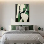 Contemporary figurative hand-painted canvas in cream and forest green with bold geometric abstraction, modern bedroom setting