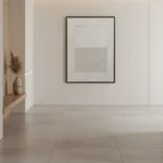 Minimalist abstract hand-painted canvas in soft cream and taupe tones with geometric composition, contemporary gallery space