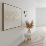 Textured hand-painted canvas with gold leaf falling leaves in cream and warm tones, contemporary hallway setting
